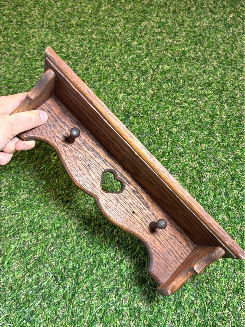 Wooden Wall Shelf with Heart Cutout and Two Pegs